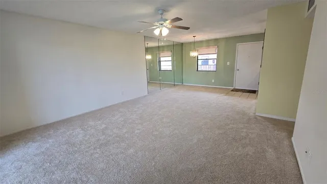a view of an entryway and livingroom