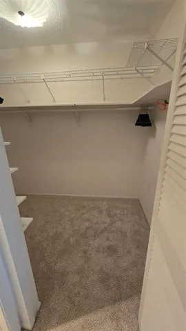 a view of a room that has a sink and a large window