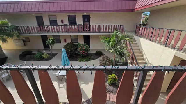 a front view of house with deck and outdoor seating