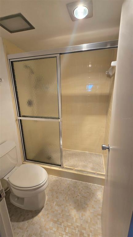 88 Boundary Boulevard, Unit 149 Rotonda West, FL 33947 - Photo 31 of 40 a white toilet sitting next to a shower