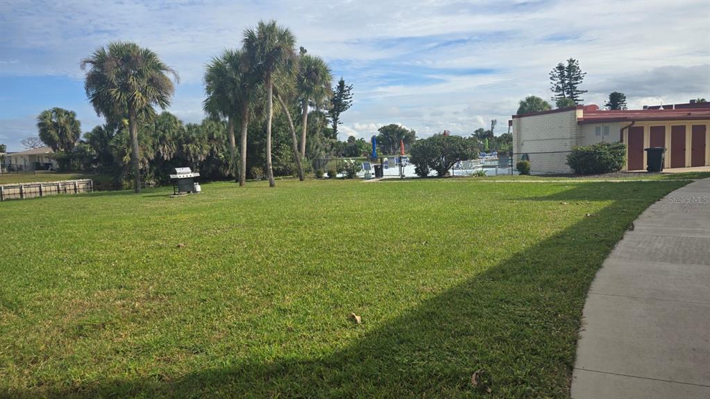 88 Boundary Boulevard, Unit 149 Rotonda West, FL 33947 - Photo 38 of 40 a view of a green field