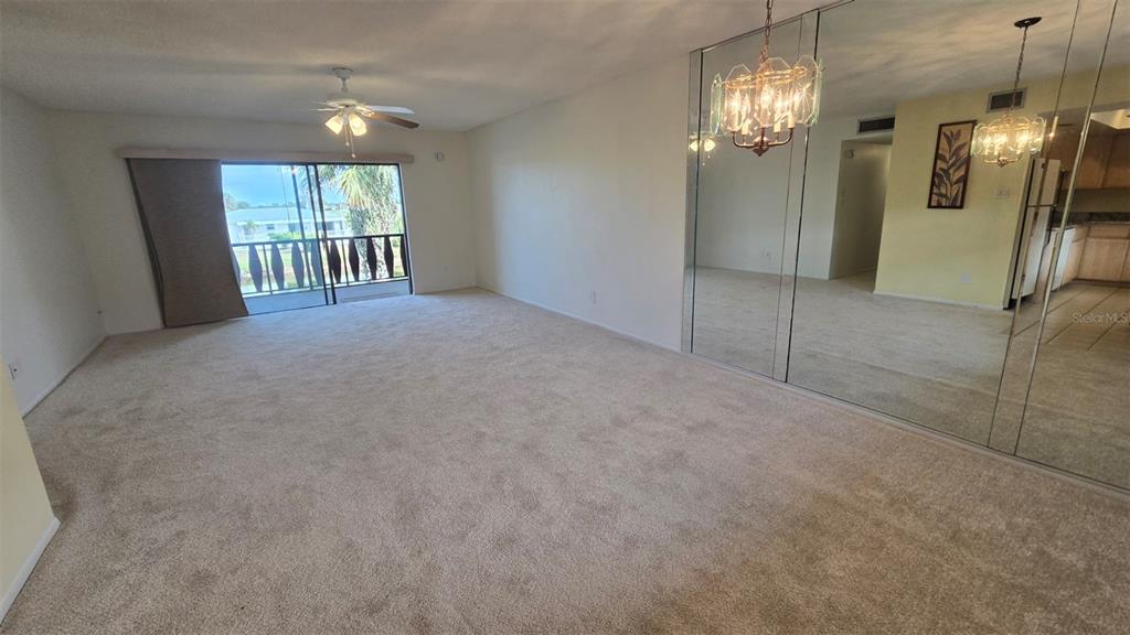 88 Boundary Boulevard, Unit 149 Rotonda West, FL 33947 - Photo 5 of 40 en empty room with windows and outdoor view