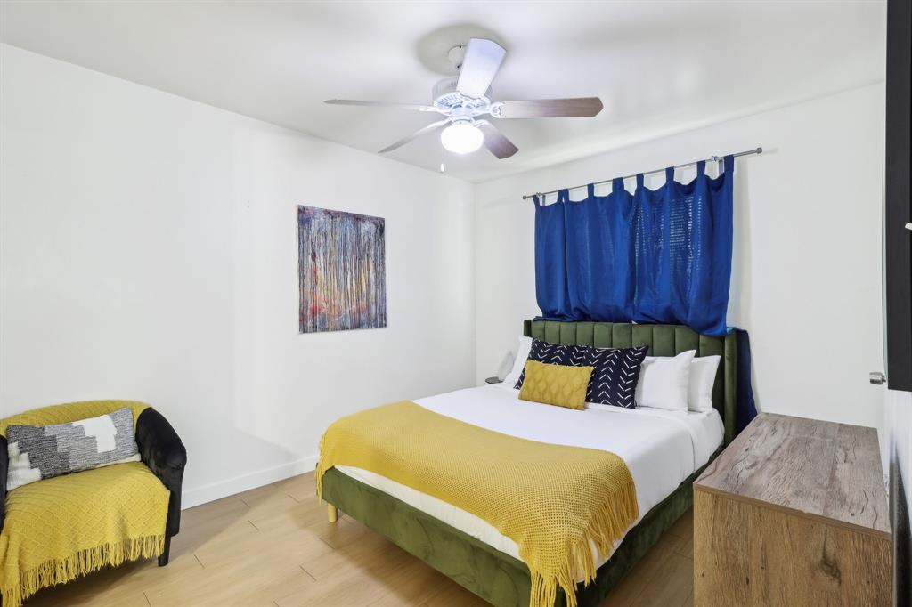 3107 Speedway, Unit 202 Austin, TX 78705 - Photo 3 of 11 a bedroom with a bed and chair
