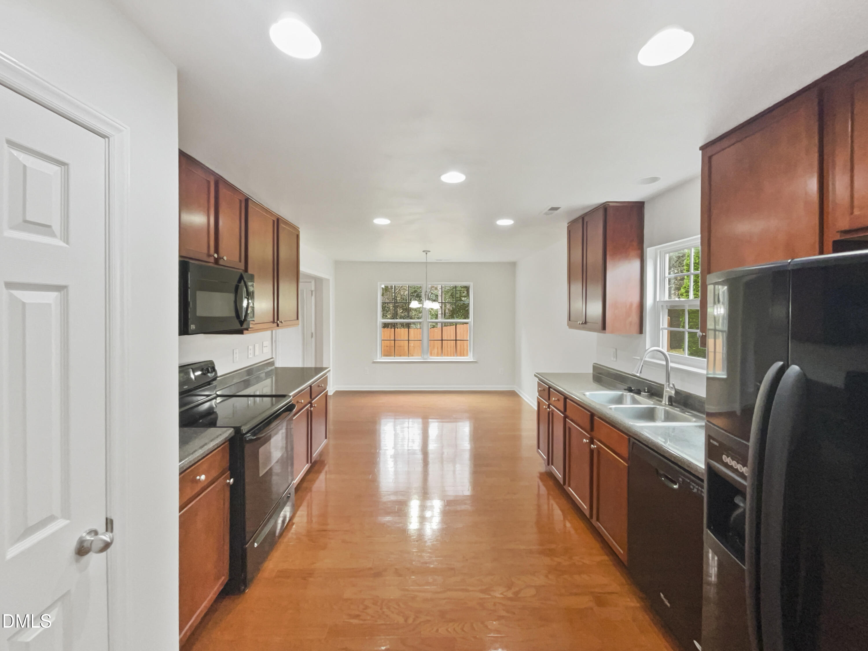 5512 Quitman Trail Raleigh, NC 27610 - Photo 11 of 18 a kitchen with stainless steel appliances granite countertop a sink stove and refrigerator