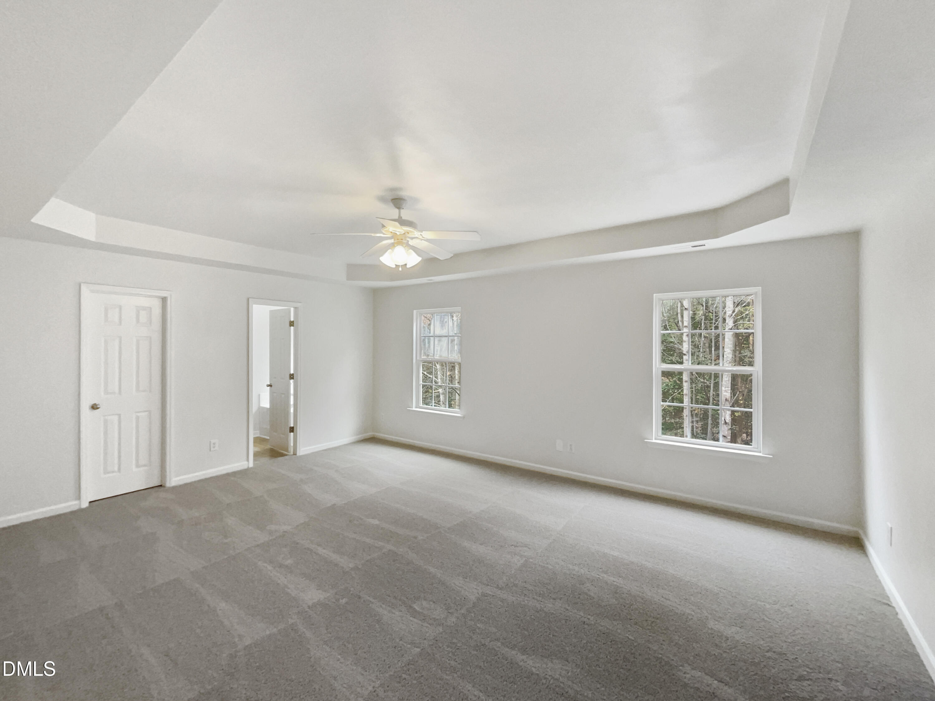 5512 Quitman Trail Raleigh, NC 27610 - Photo 14 of 18 a view of a big room with windows and chandelier fan