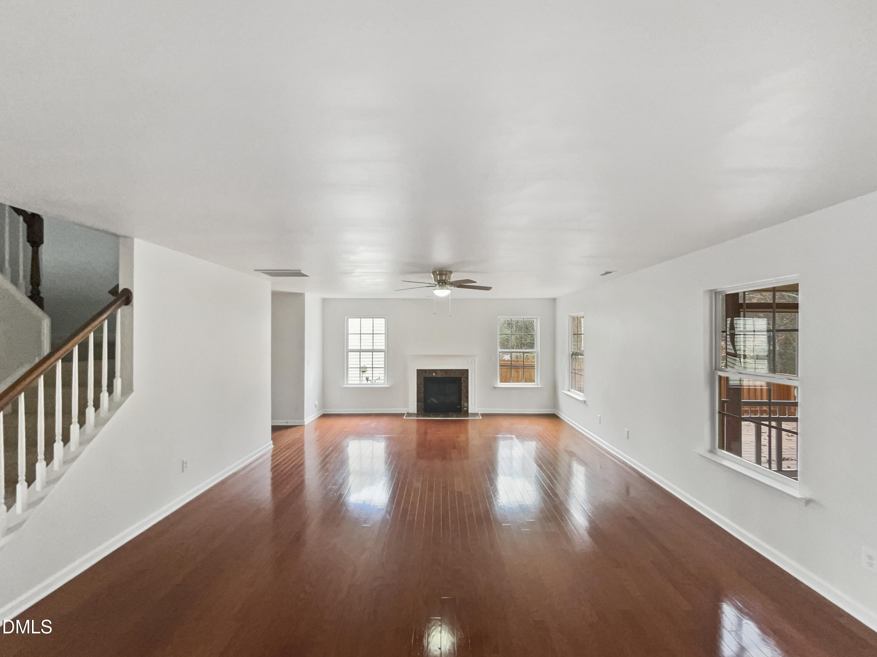 5512 Quitman Trail Raleigh, NC 27610 - Photo 4 of 18 an empty room with windows and fireplace