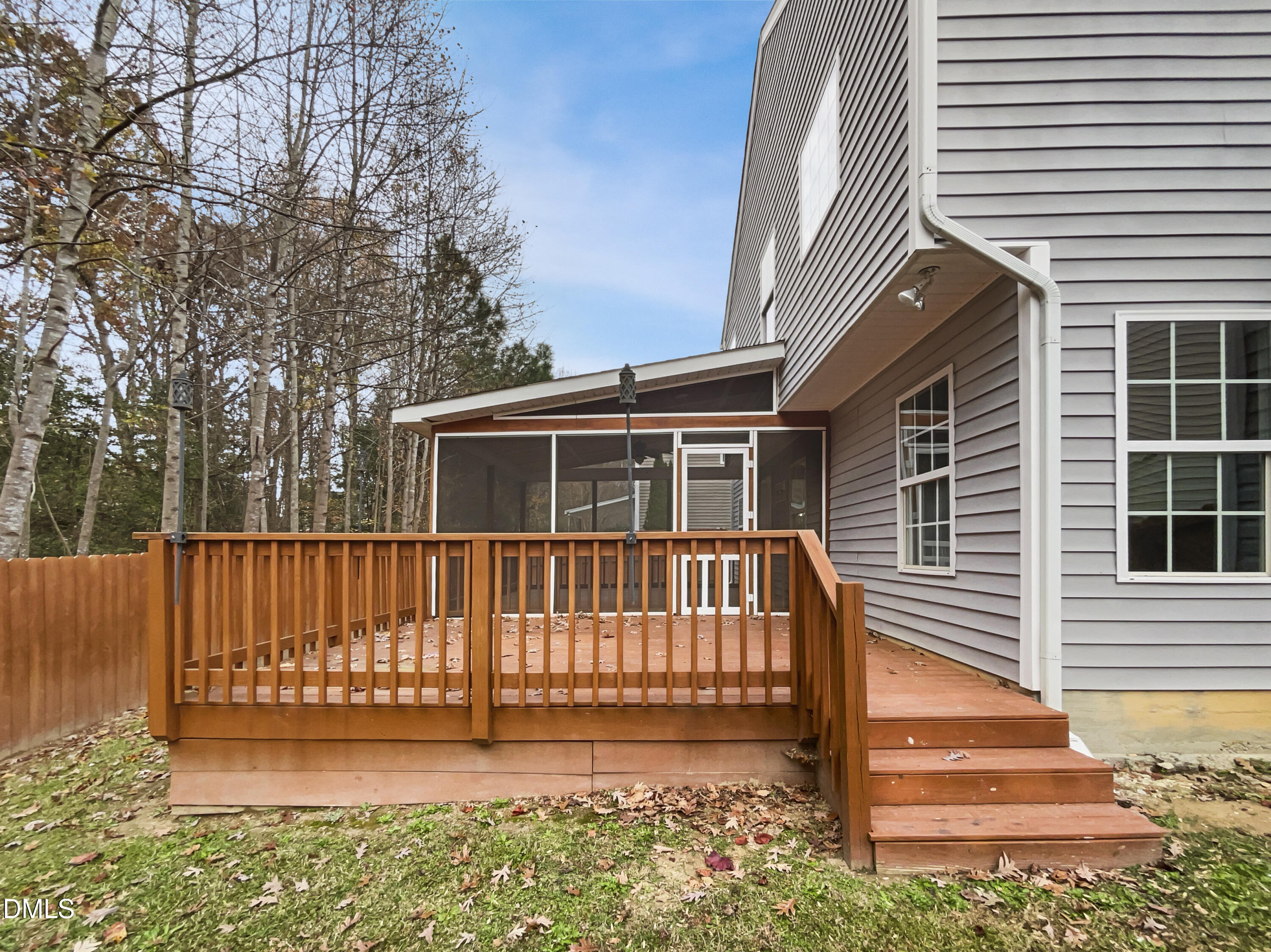 5512 Quitman Trail Raleigh, NC 27610 - Photo 9 of 18 a view of a house with a small yard and wooden fence