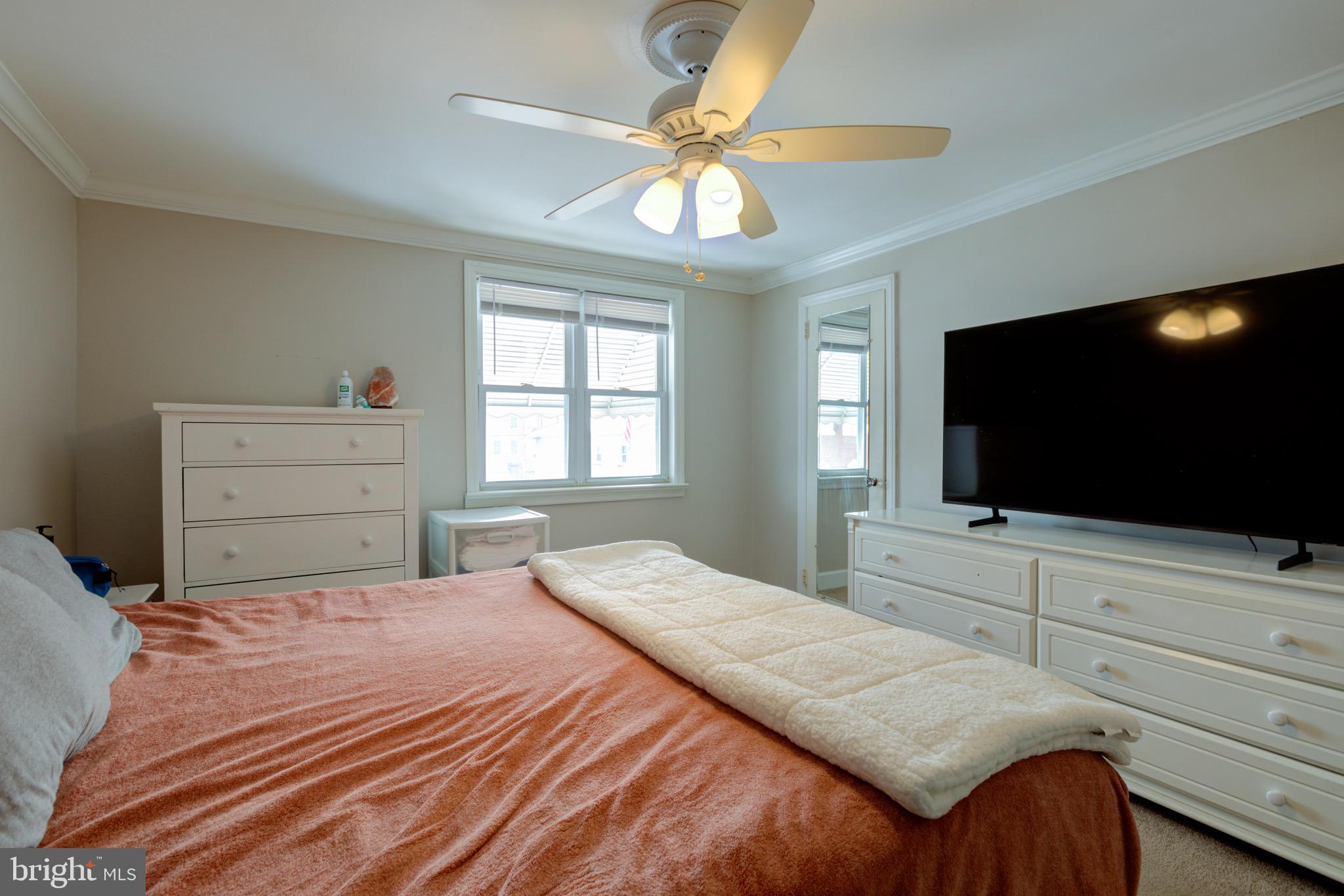 203 Overlook Road Philadelphia, PA 19128 - Photo 16 of 32 a bedroom with a bed and a flat screen tv