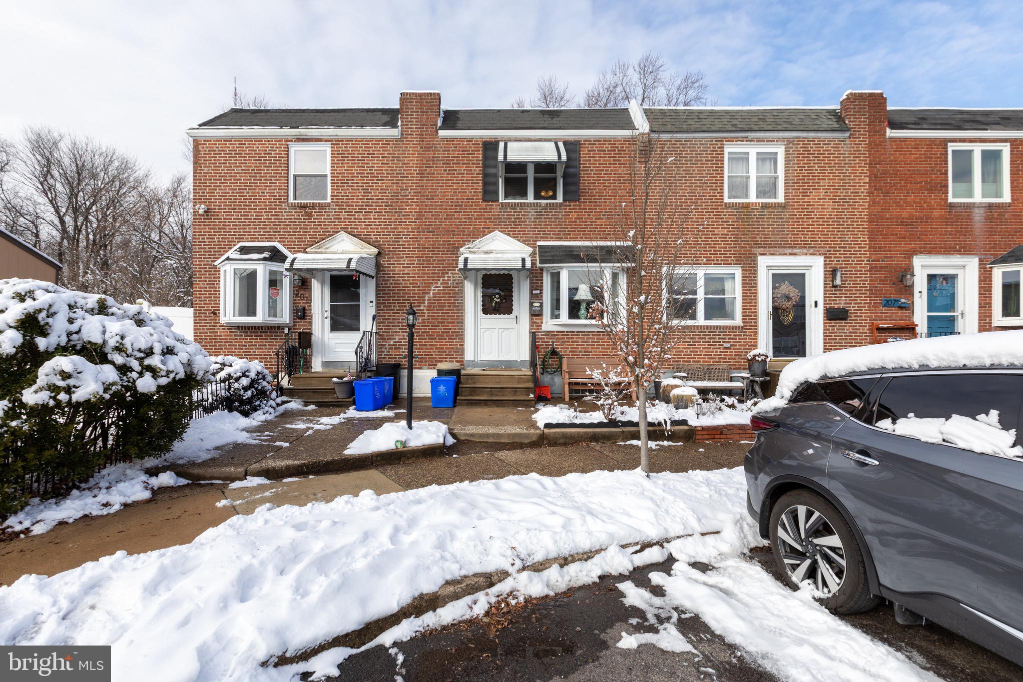 203 Overlook Road Philadelphia, PA 19128 - Photo 2 of 32 a front view of a house with cars parked