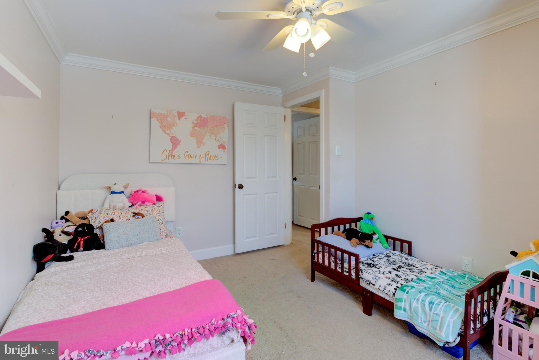 203 Overlook Road Philadelphia, PA 19128 - Photo 22 of 32 a bedroom with furniture and a chandelier