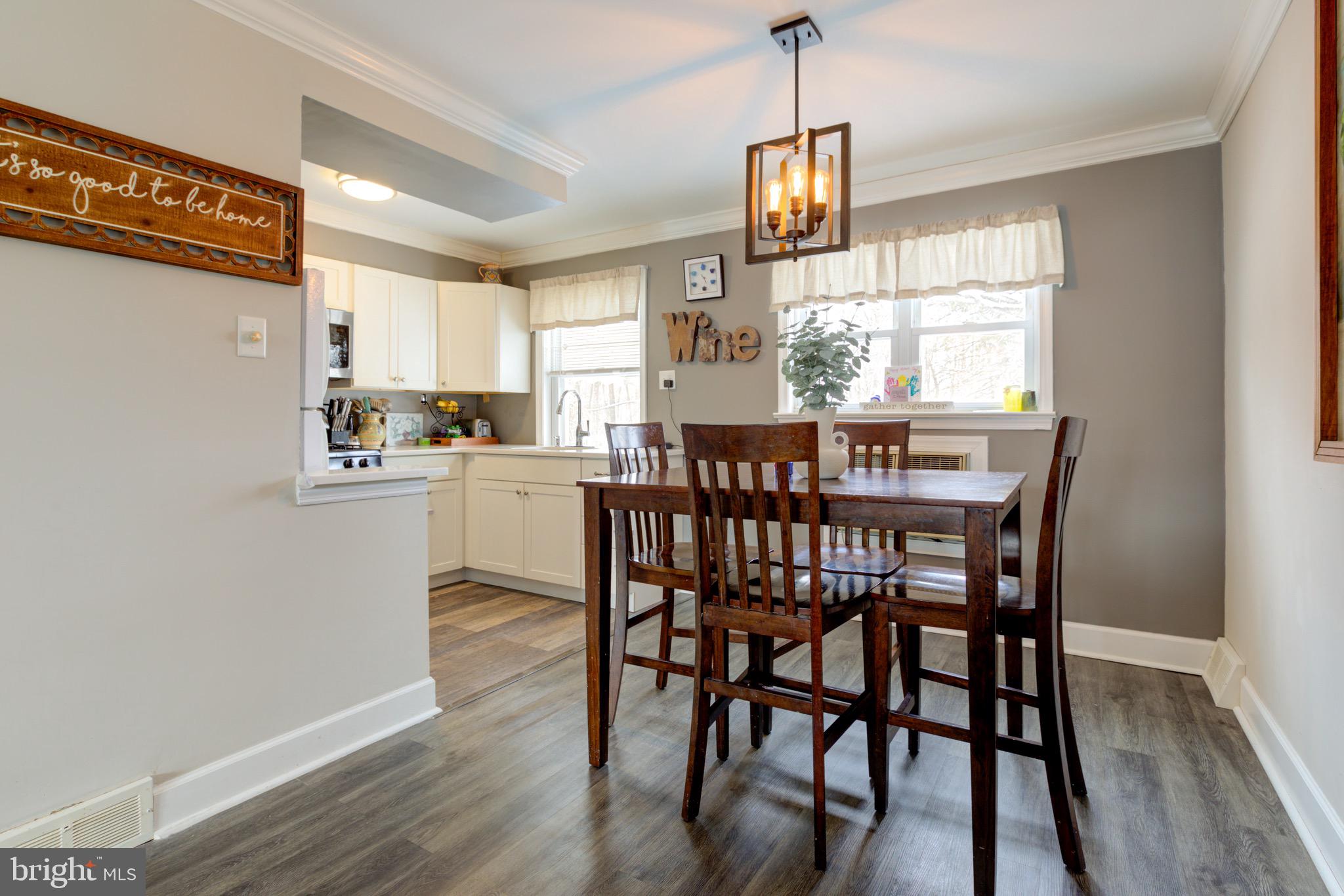 203 Overlook Road Philadelphia, PA 19128 - Photo 8 of 32 a view of a dining room with furniture window and wooden floor