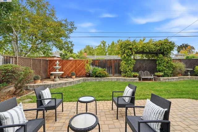 a view of yard with seating area and green space