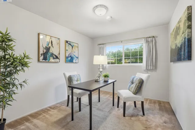 a workspace with furniture and window