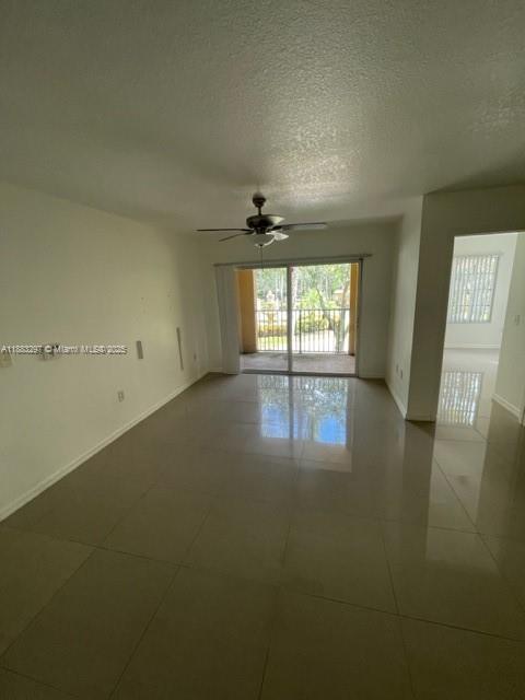 4271 San Marino Boulevard, Unit 206 West Palm Beach, FL 33409 - Photo 4 of 9 wooden floor in an empty room with a window