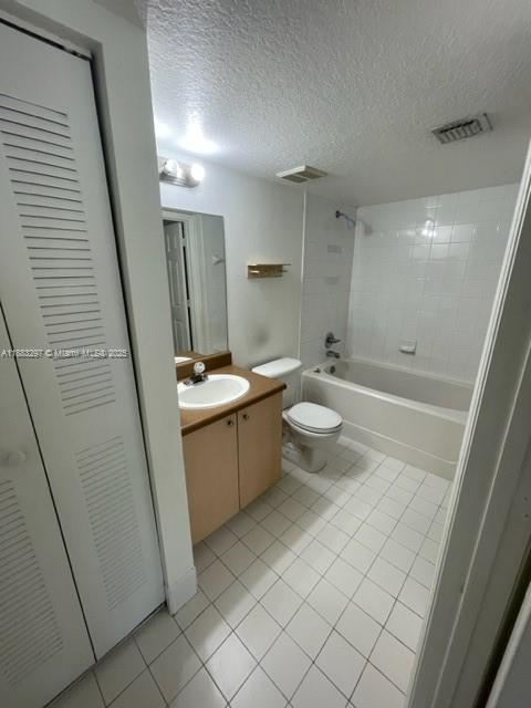 4271 San Marino Boulevard, Unit 206 West Palm Beach, FL 33409 - Photo 9 of 9 a bathroom with a sink a toilet and shower