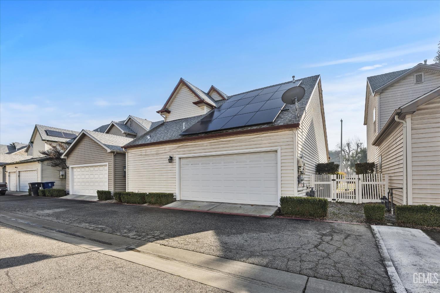 Undisclosed Address Bakersfield, CA 93301 - Photo 21 of 30 a front view of a house with a yard