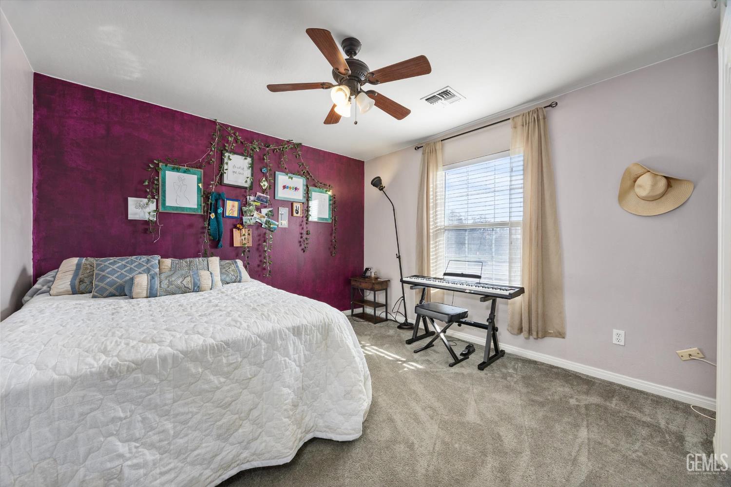 Undisclosed Address Bakersfield, CA 93301 - Photo 27 of 30 a bed room with a bed and a chair