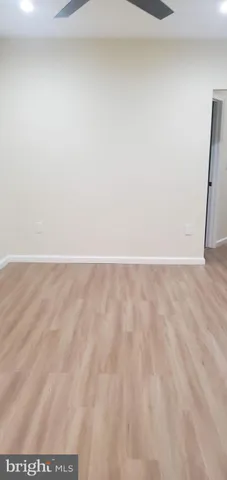 a kitchen with granite countertop a stove top oven sink and cabinets