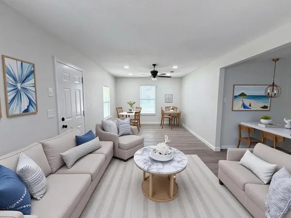 a living room with furniture and a table