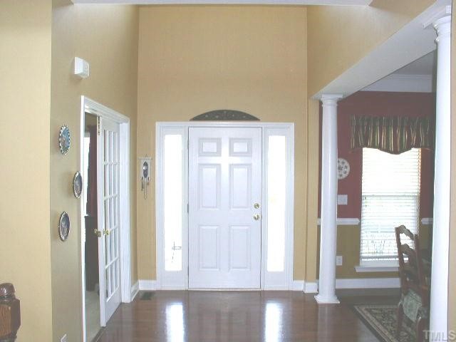10436 Chandler Way Raleigh, NC 27614 - Photo 6 of 11 2-Story Foyer welcomes your guests. Rich Dark Oak hardwoods tead you past the Formal Dining Room and Living Room and into the Family Room.