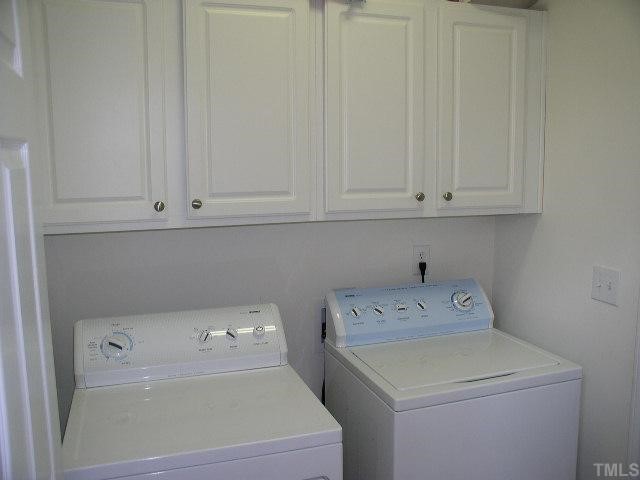 10436 Chandler Way Raleigh, NC 27614 - Photo 10 of 11 Laundry Room has built in cabinets and located off the garage. Sellers are including the washer and dryer.