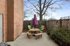 a view of a bench in the backyard