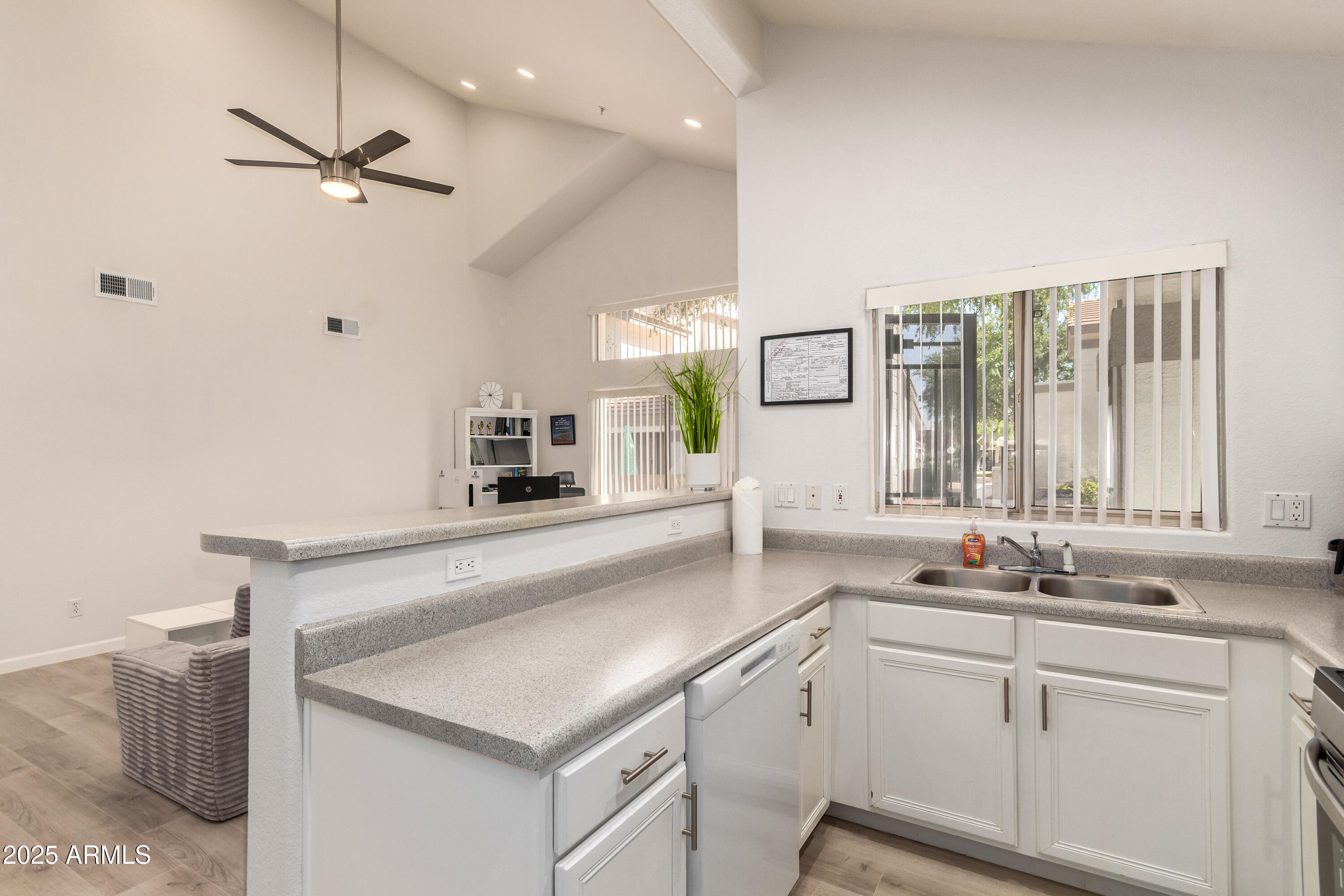 2201 North Comanche Drive, Unit 1080 Chandler, AZ 85224 - Photo 11 of 18 a kitchen with a sink cabinets and window