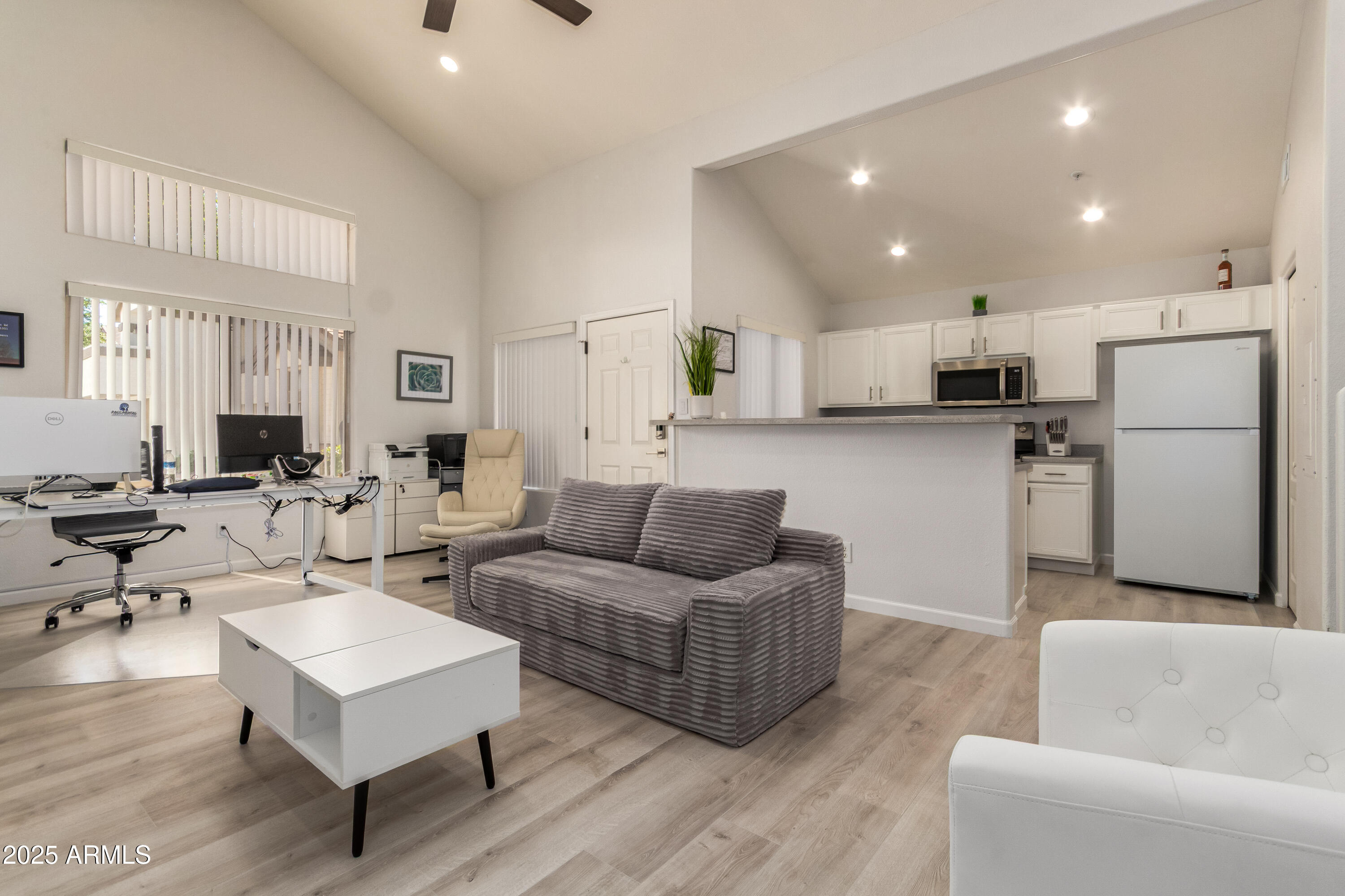 2201 North Comanche Drive, Unit 1080 Chandler, AZ 85224 - Photo 6 of 18 a living room with furniture and kitchen view