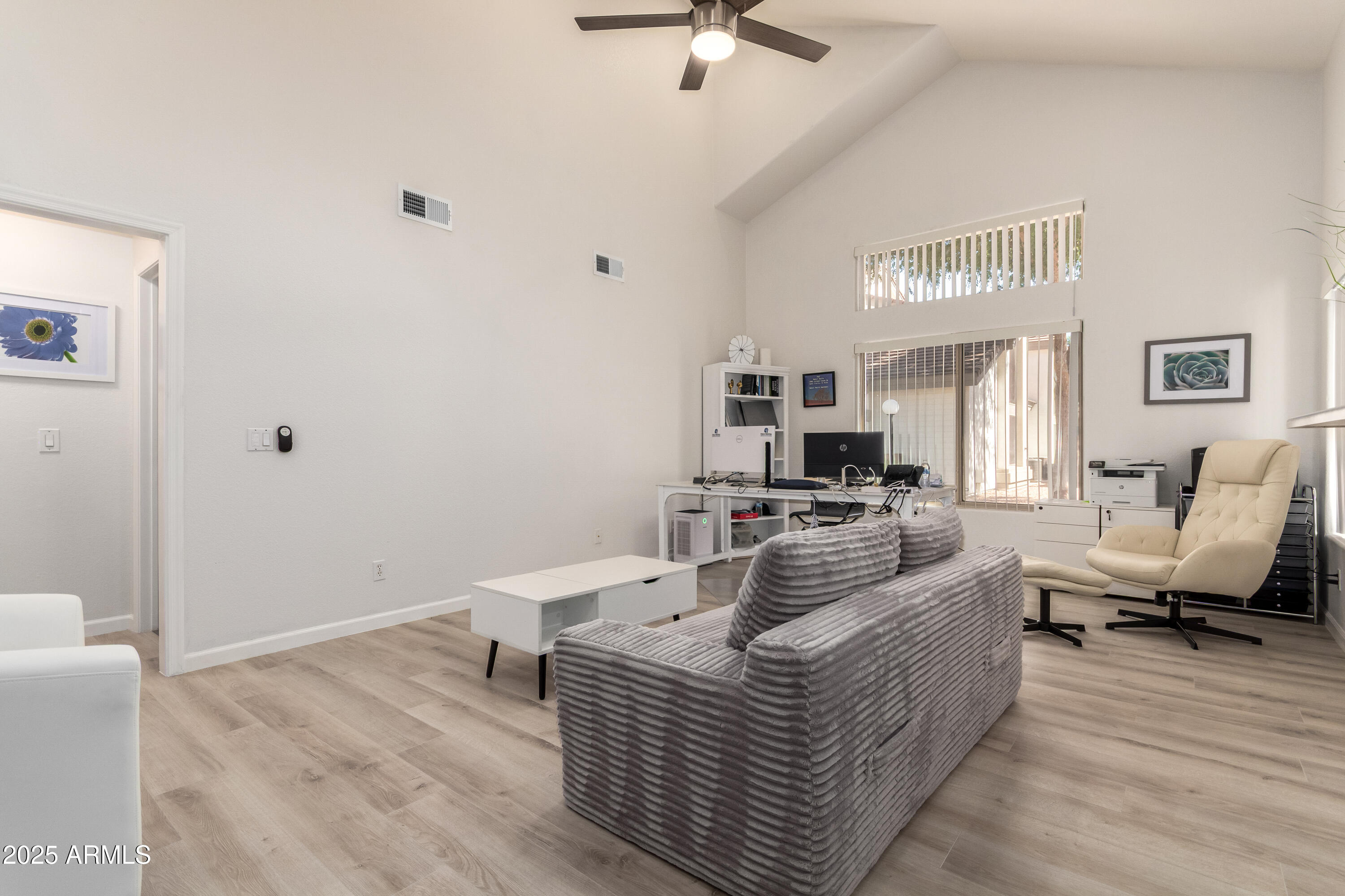 2201 North Comanche Drive, Unit 1080 Chandler, AZ 85224 - Photo 7 of 18 a living room with furniture and a flat screen tv