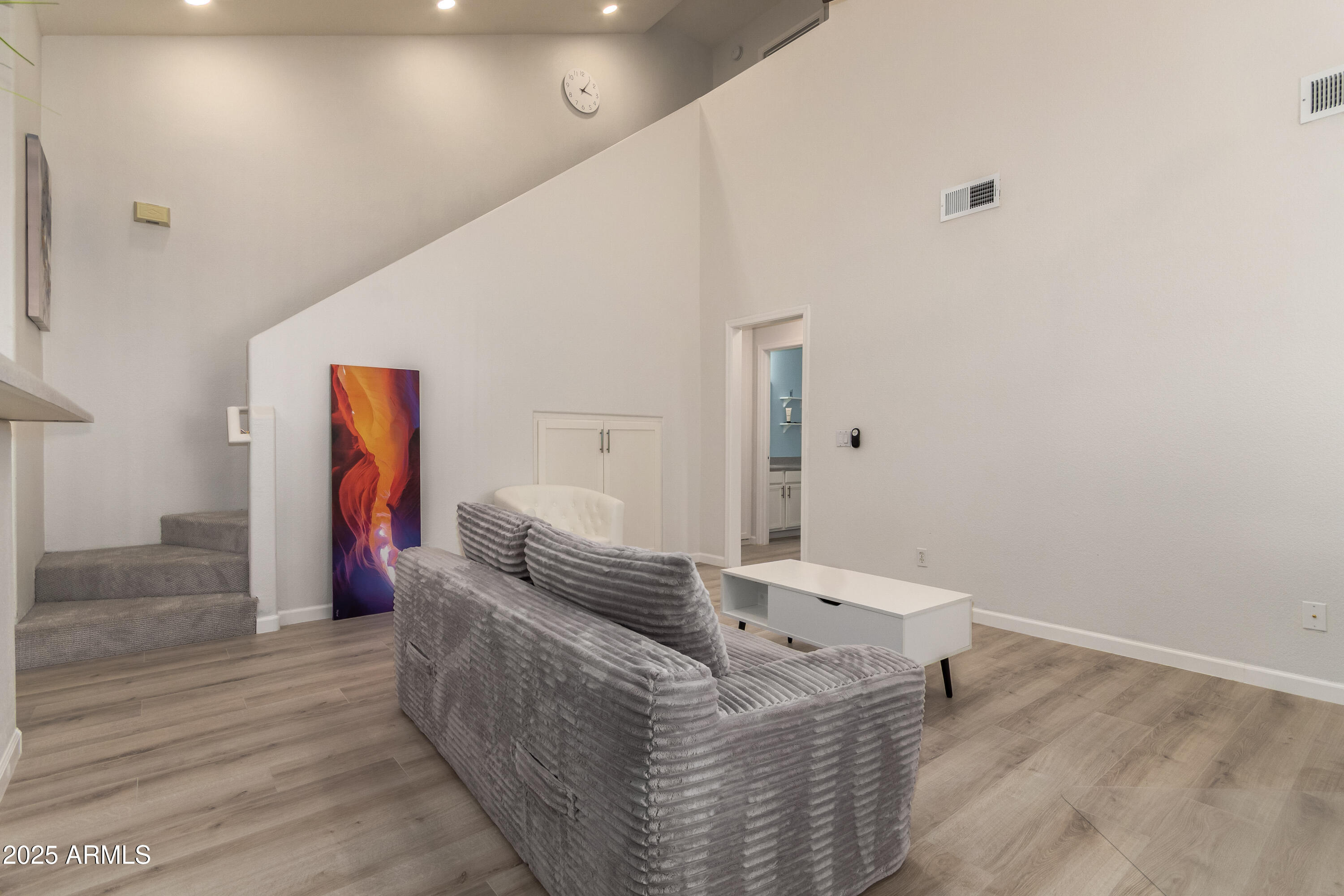 2201 North Comanche Drive, Unit 1080 Chandler, AZ 85224 - Photo 8 of 18 a living room with furniture and wooden floor
