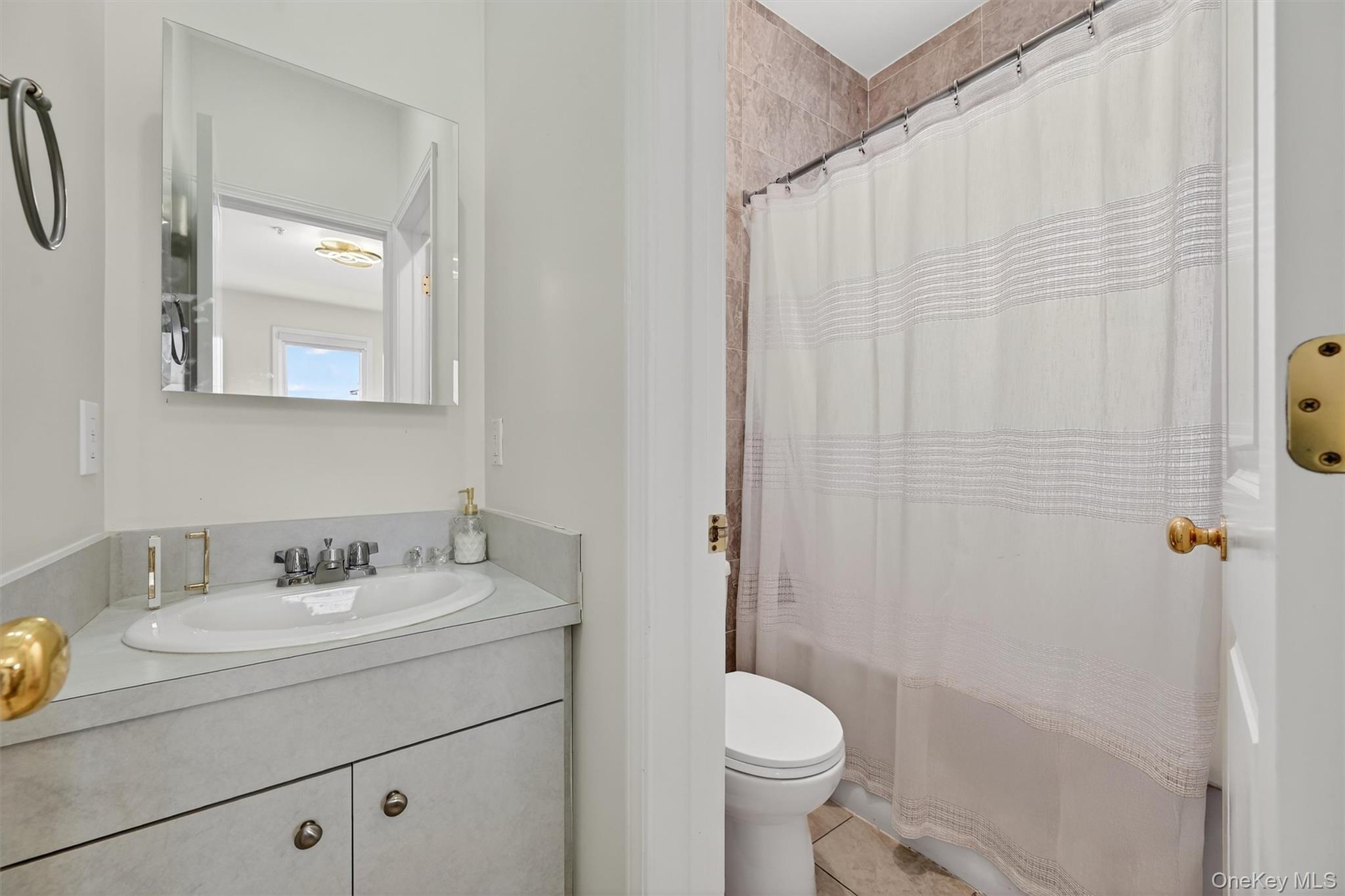 6 Garfield Road, Unit 311 Monroe, NY 10950 - Photo 17 of 32 a bathroom with a sink a toilet and shower