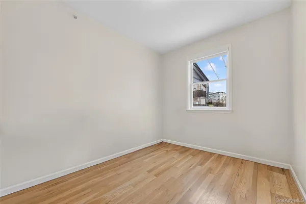 a view of a backyard with wooden fence
