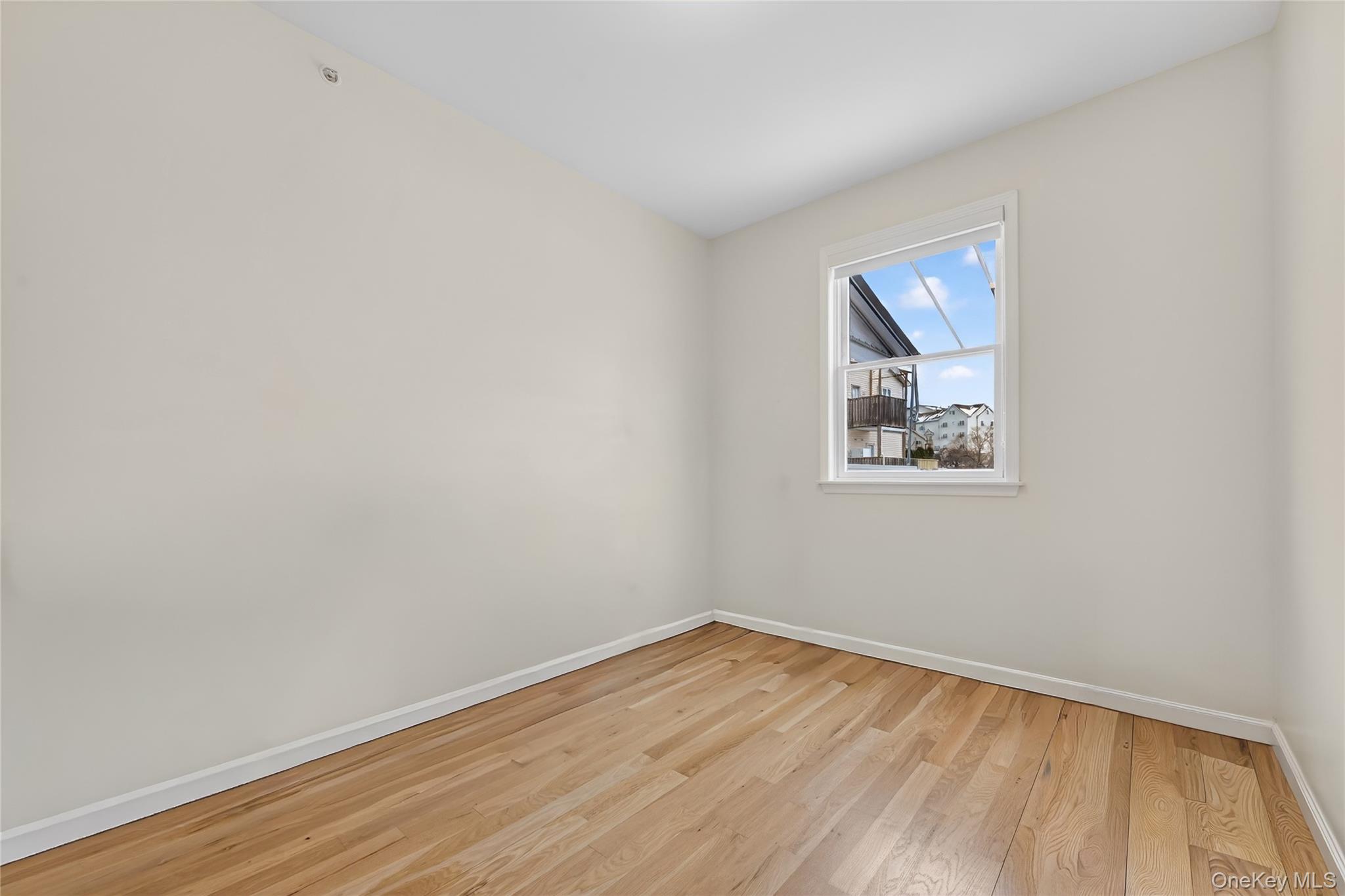 6 Garfield Road, Unit 311 Monroe, NY 10950 - Photo 20 of 32 a view of empty room with wooden floor