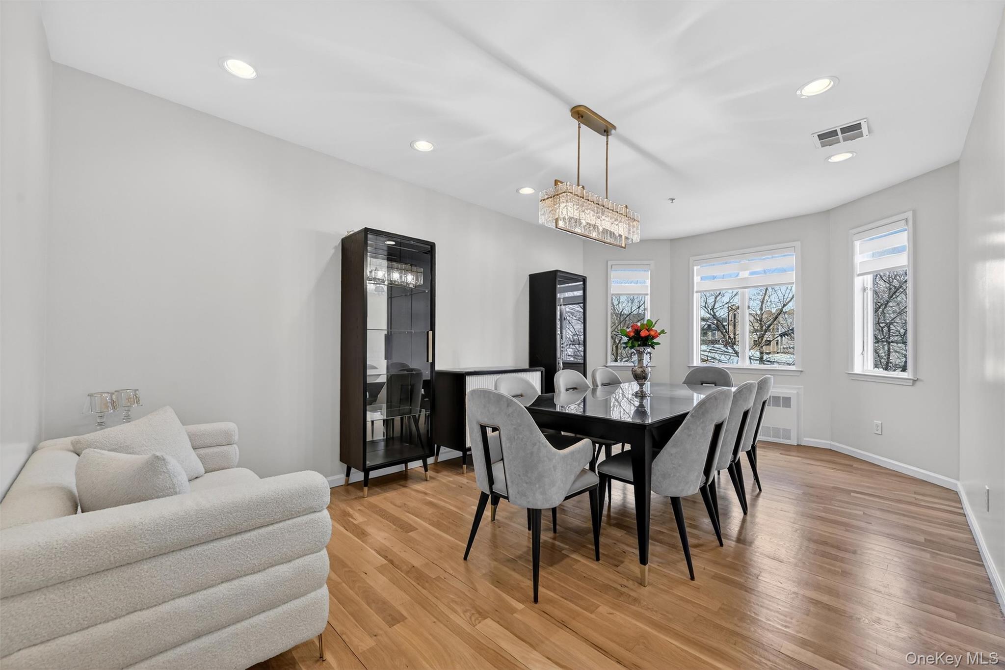 6 Garfield Road, Unit 311 Monroe, NY 10950 - Photo 4 of 32 a view of a dining room with furniture and wooden floor