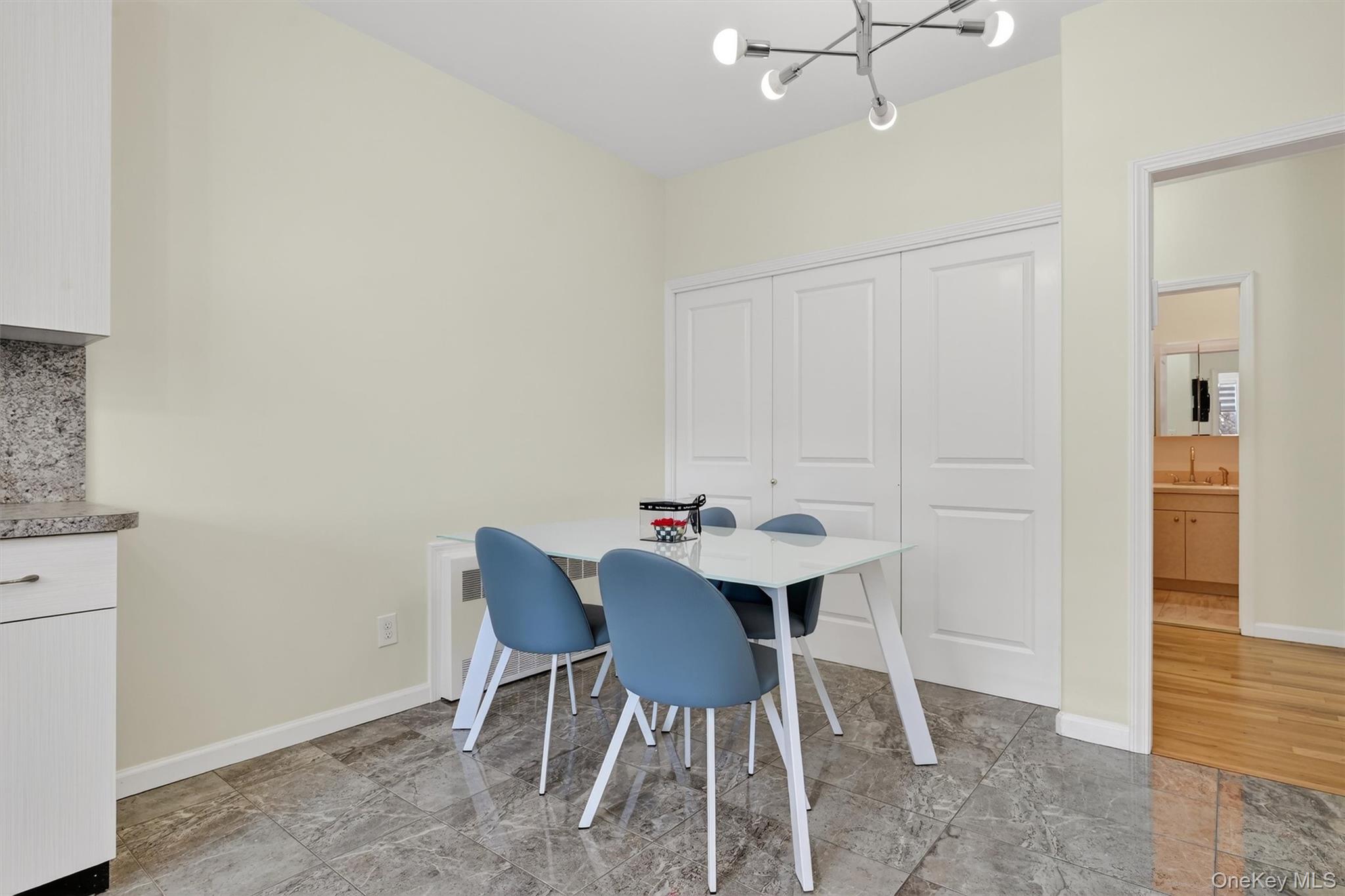 6 Garfield Road, Unit 311 Monroe, NY 10950 - Photo 8 of 32 a view of a dining room with furniture and wooden floor