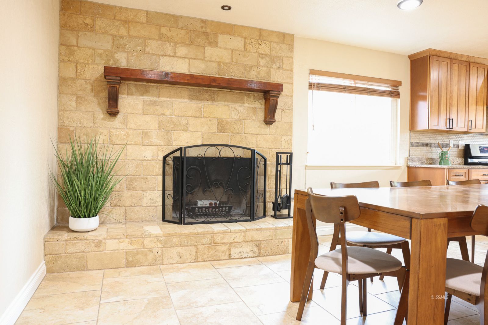 1051 Peg Street Ridgecrest, CA 93555 - Photo 4 of 34 a living room with a fireplace and a table