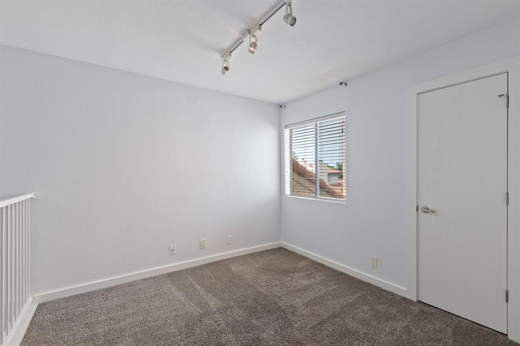 4777 Cedar Springs Road, Unit 6N Dallas, TX 75219 - Photo 20 of 24 an empty room with a empty space and windows