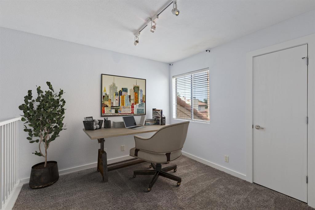 4777 Cedar Springs Road, Unit 6N Dallas, TX 75219 - Photo 5 of 24 a view of a workspace with a window and workspace