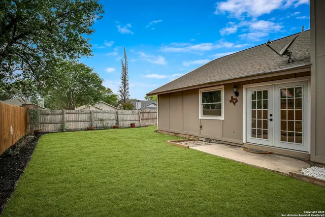 a backyard of a house with lots of green space