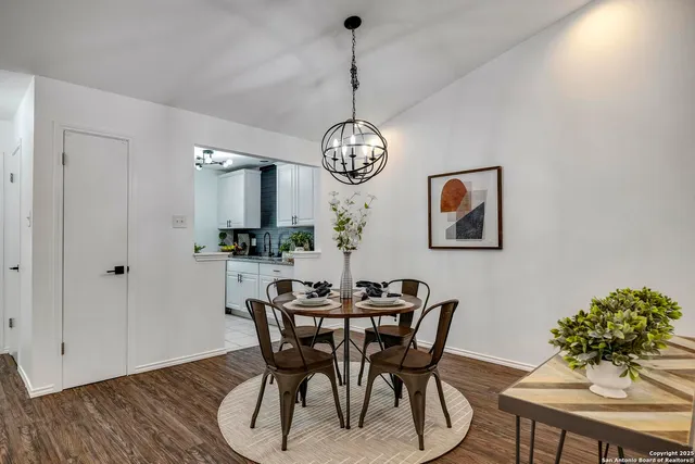 a dining room with furniture and window