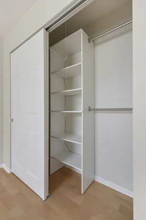 a view of an empty walk in closet