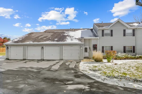 a view of a house with a snow on the road