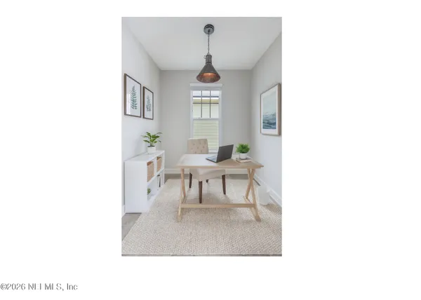 a living room with furniture and window