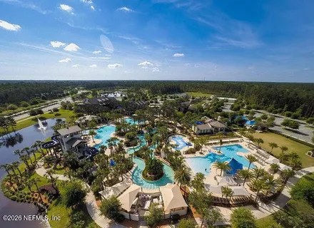 an aerial view of houses with outdoor space