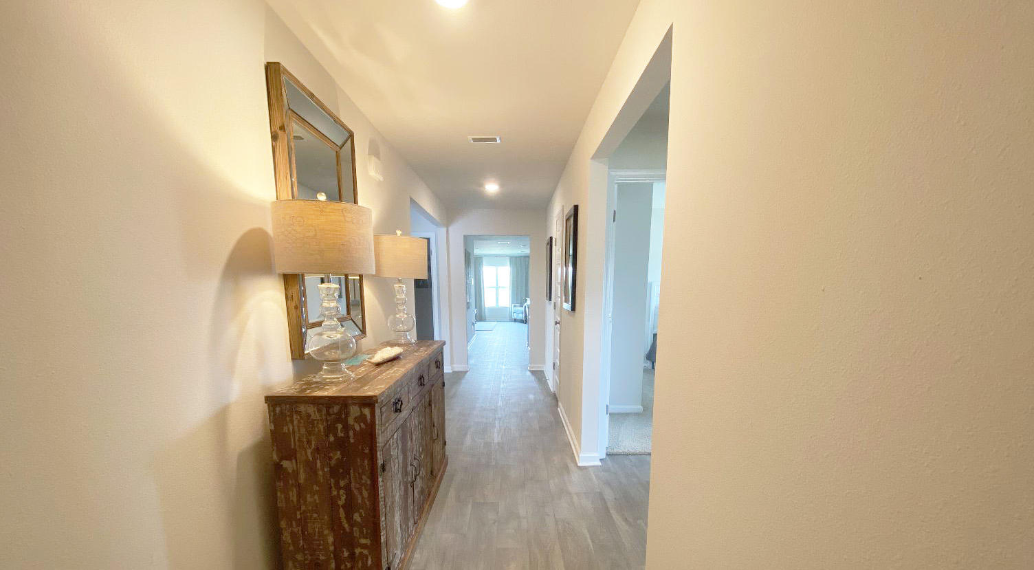 949 Indian Woman Road Santa Rosa Beach, FL 32459 - Photo 3 of 23 a view of a hallway with wooden floor