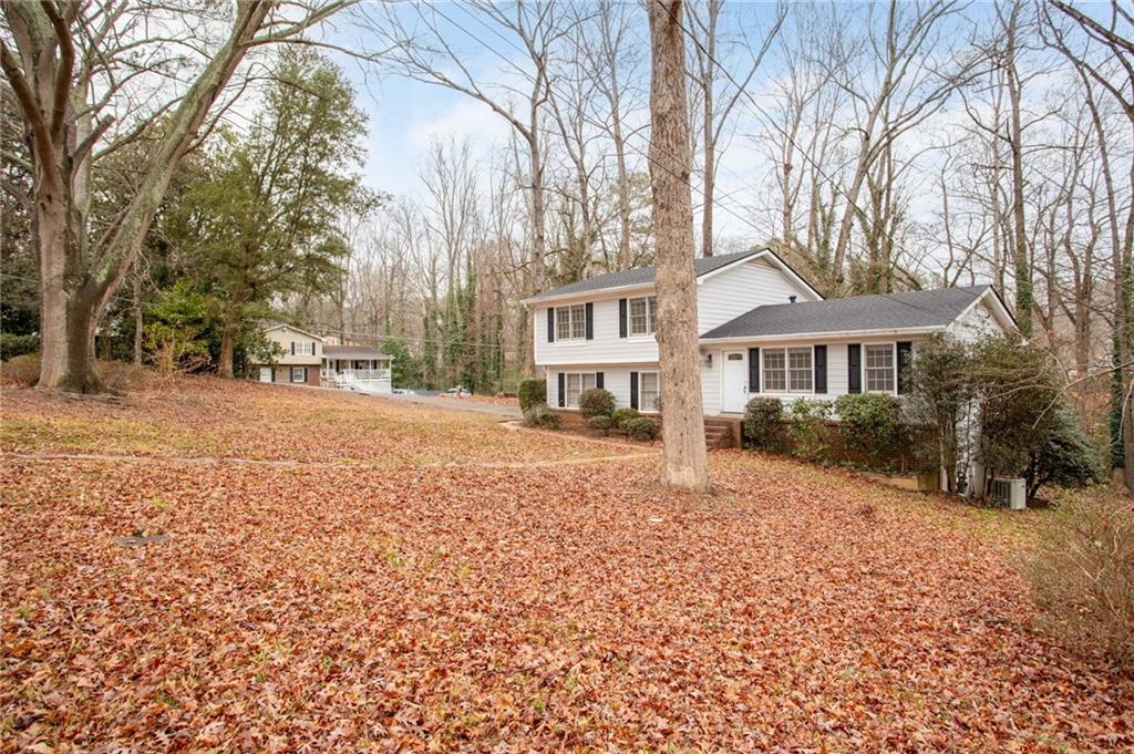 584 Fieldstream Way Northwest Lawrenceville, GA 30044 - Photo 3 of 20 a front view of a house with a yard covered with snow