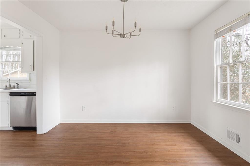 584 Fieldstream Way Northwest Lawrenceville, GA 30044 - Photo 7 of 20 a view of a room with wooden floor and windows