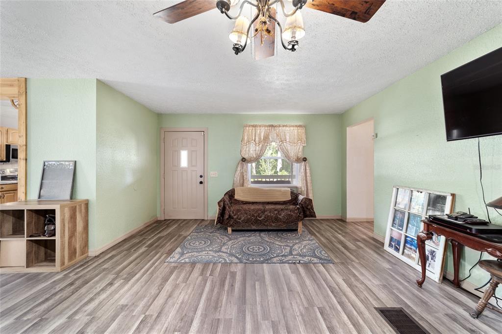 15755 Southwest 90th Avenue Dunnellon, FL 34432 - Photo 13 of 55 a bedroom with furniture and a flat screen tv