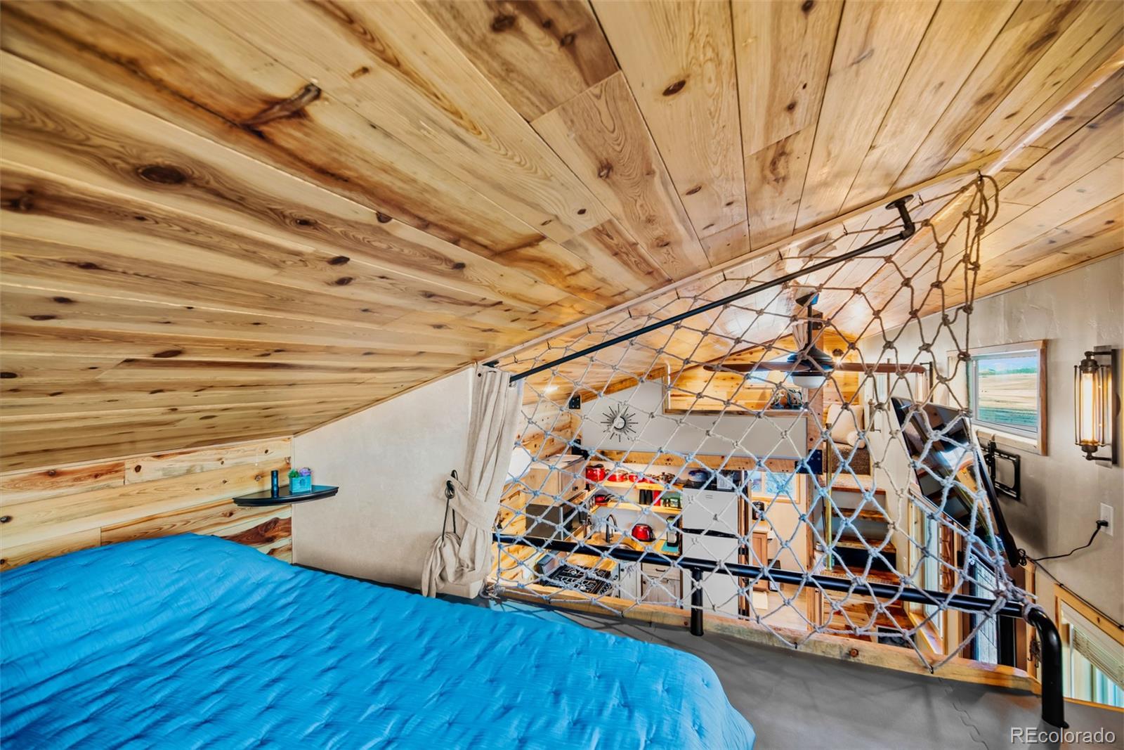 189 Goldenburg Canyon Road Hartsel, CO 80449 - Photo 15 of 36 a view of a room with wooden floors