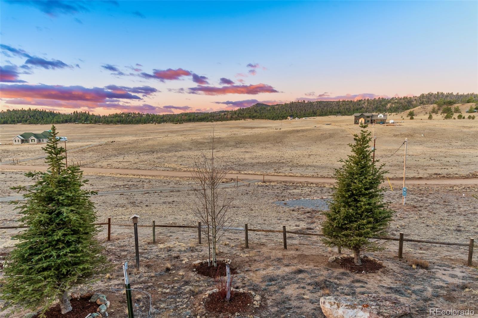 189 Goldenburg Canyon Road Hartsel, CO 80449 - Photo 20 of 36 a view of a lake with houses in the back